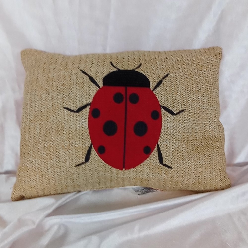 Indoor outdoor ladybug throw pillow